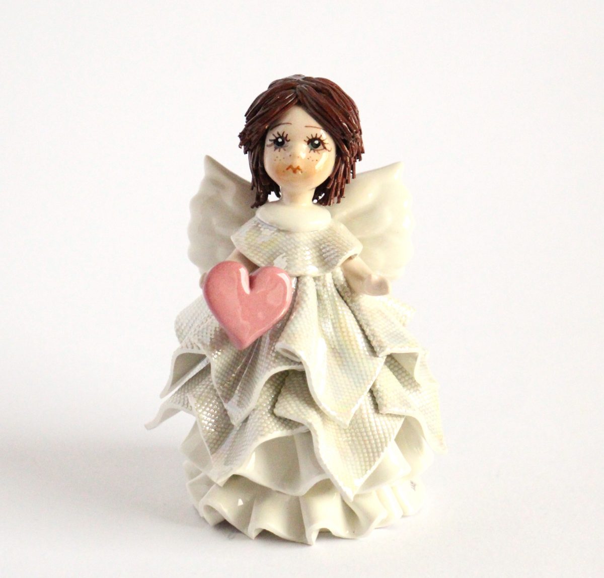 Standing angel with a heart